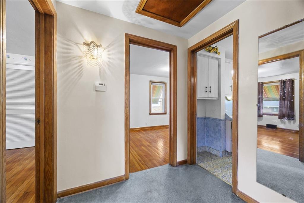 1233 Virginia Avenue Midland, PA 15059 - Photo 20 of 44 a view of a hallway with wooden floor