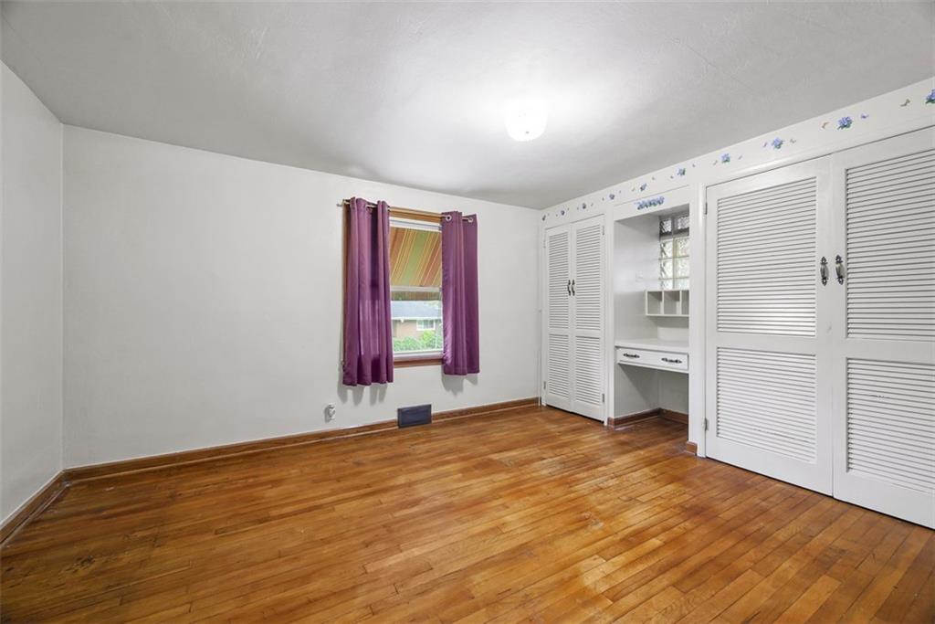 1233 Virginia Avenue Midland, PA 15059 - Photo 23 of 44 a view of a kitchen with wooden floor and windows