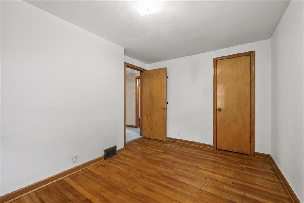 1233 Virginia Avenue Midland, PA 15059 - Photo 25 of 44 a view of empty room with wooden floor