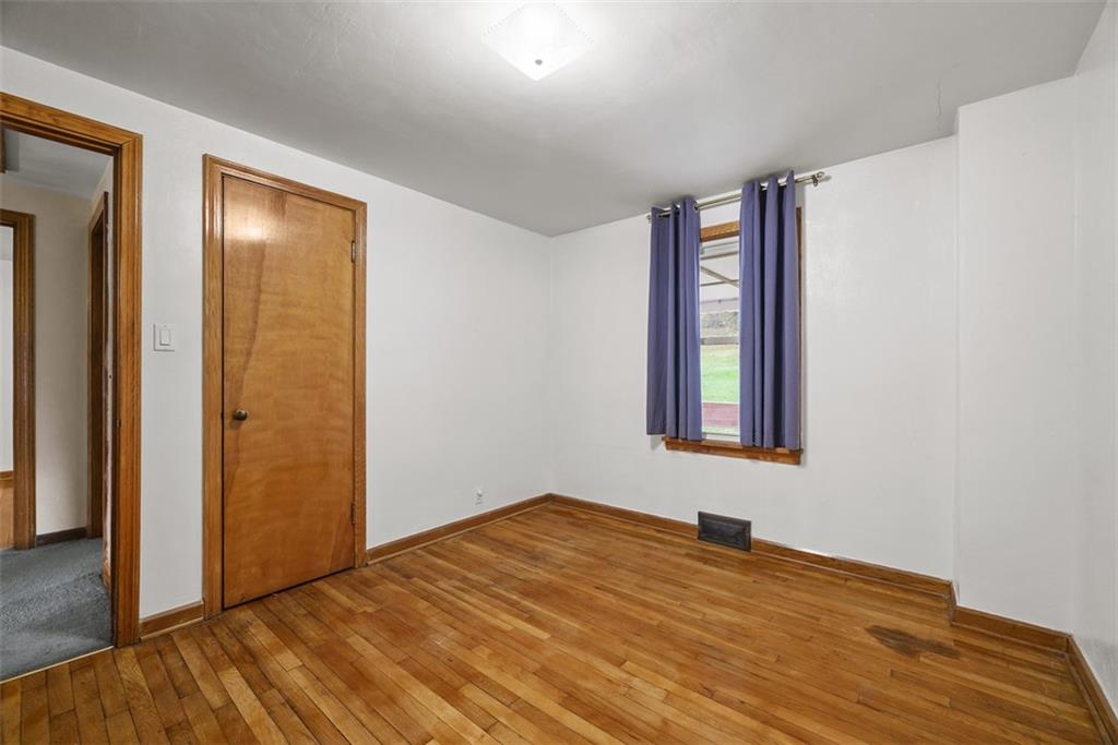 1233 Virginia Avenue Midland, PA 15059 - Photo 26 of 44 a view of an empty room with window and closet area