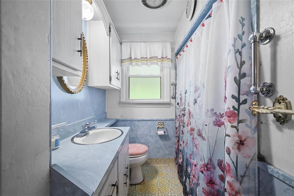 1233 Virginia Avenue Midland, PA 15059 - Photo 28 of 44 a bathroom with a sink toilet and shower