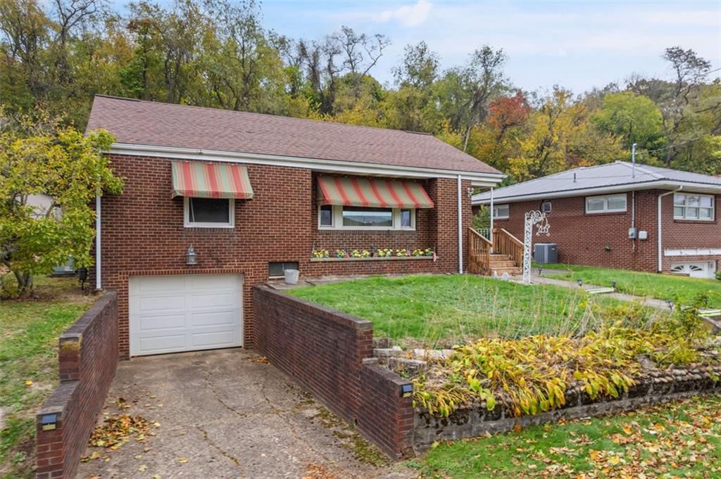 1233 Virginia Avenue Midland, PA 15059 - Photo 3 of 44 a aerial view of a house with a yard and potted plants
