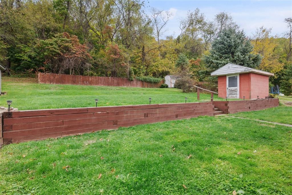 1233 Virginia Avenue Midland, PA 15059 - Photo 37 of 44 a view of a yard with a house in the background