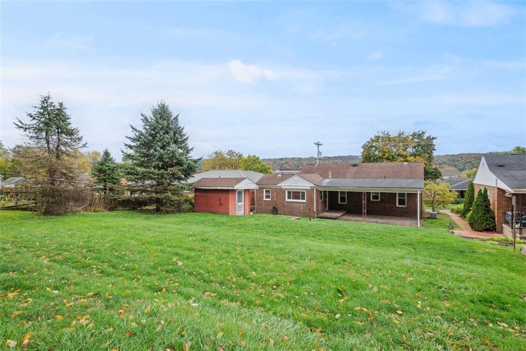 1233 Virginia Avenue Midland, PA 15059 - Photo 38 of 44 front view of a house with a yard