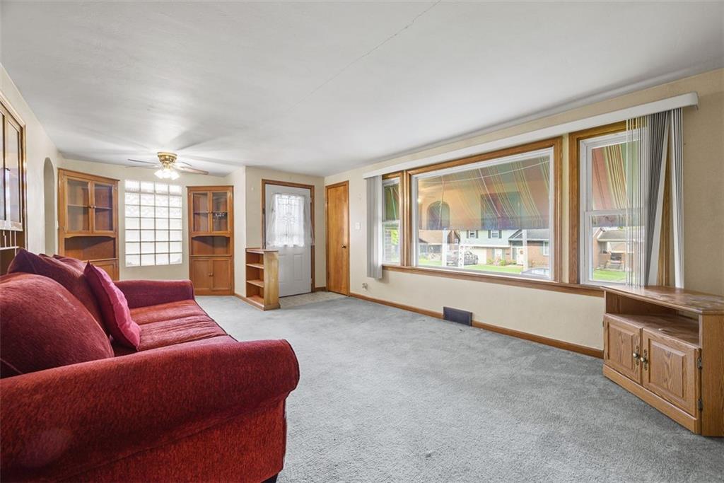 1233 Virginia Avenue Midland, PA 15059 - Photo 10 of 44 a living room with furniture and a large window