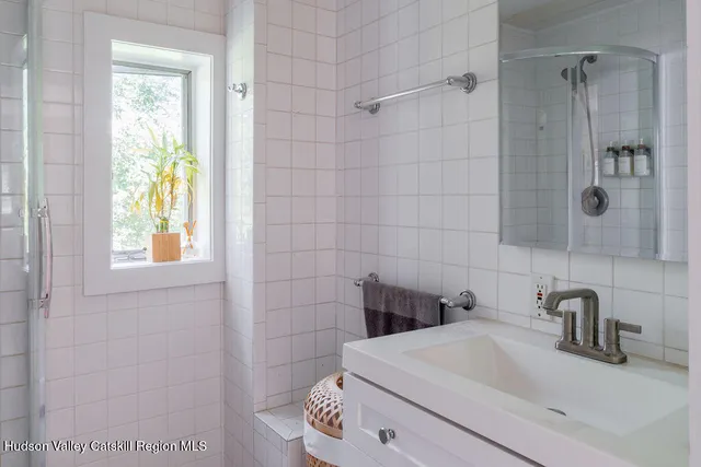 a bathroom with a sink and a shower