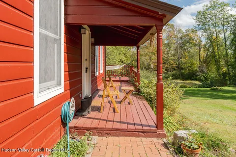 a view of a balcony with yard