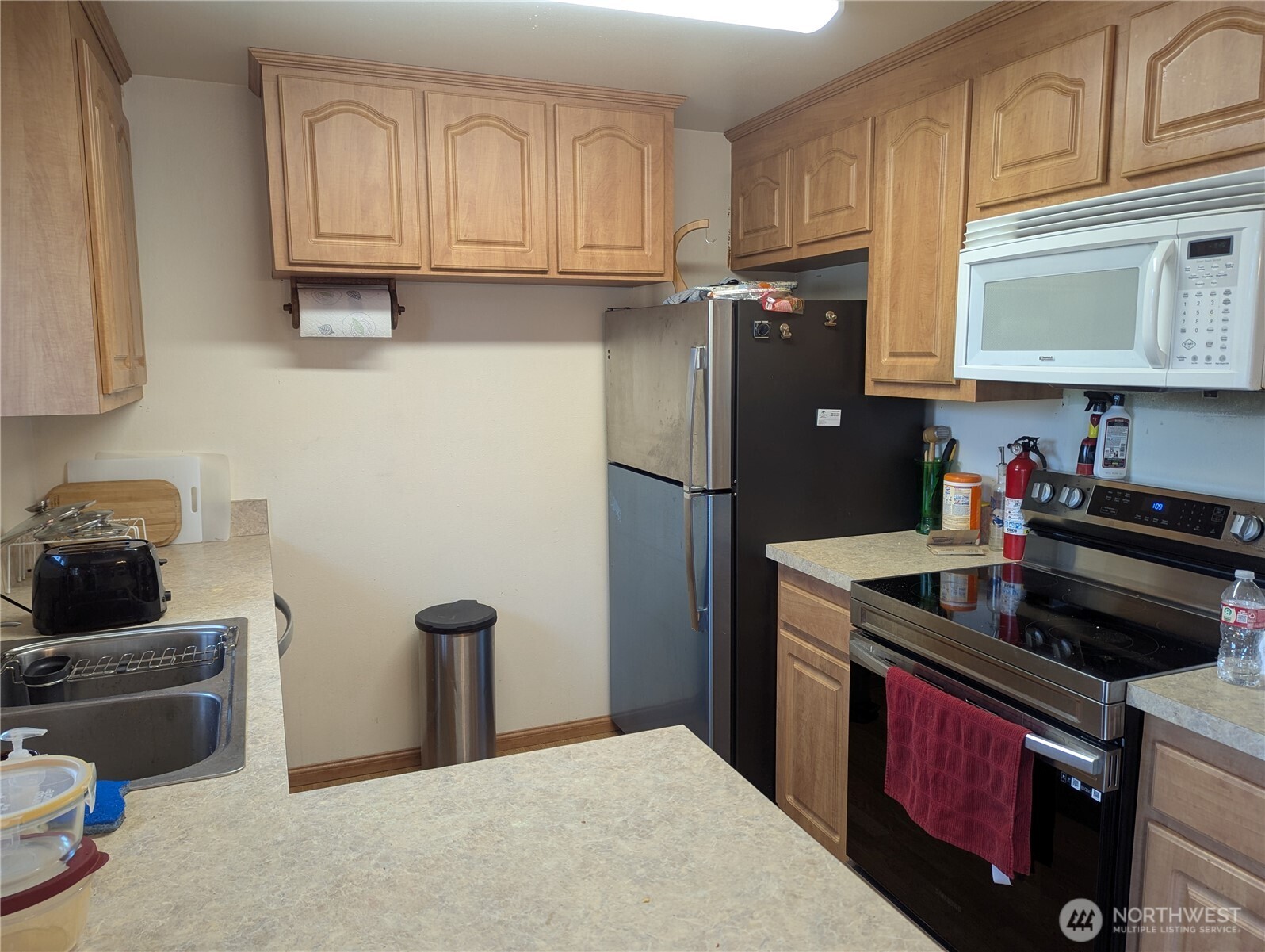 72 Ridge View Drive Sequim, WA 98382 - Photo 6 of 31 a kitchen with stainless steel appliances granite countertop a refrigerator stove and sink