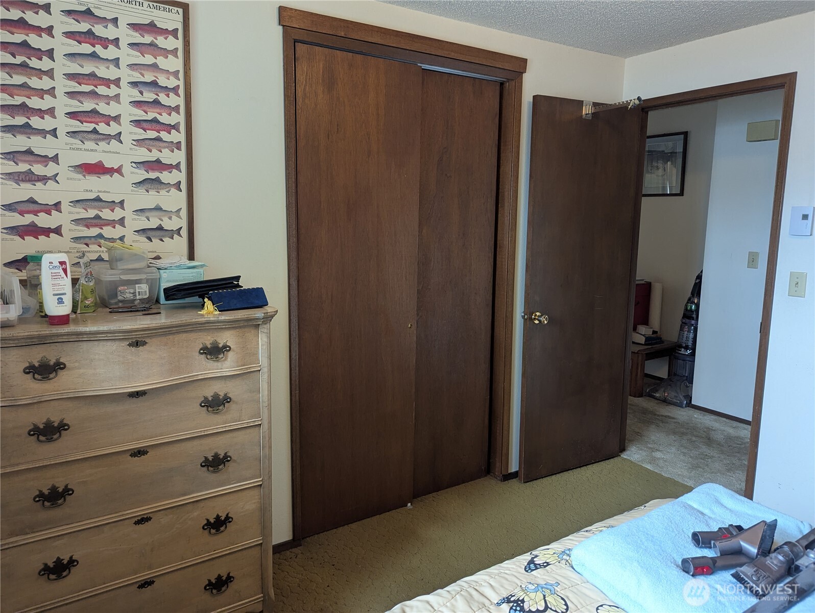 72 Ridge View Drive Sequim, WA 98382 - Photo 10 of 31 a bedroom with a dresser and a mirror