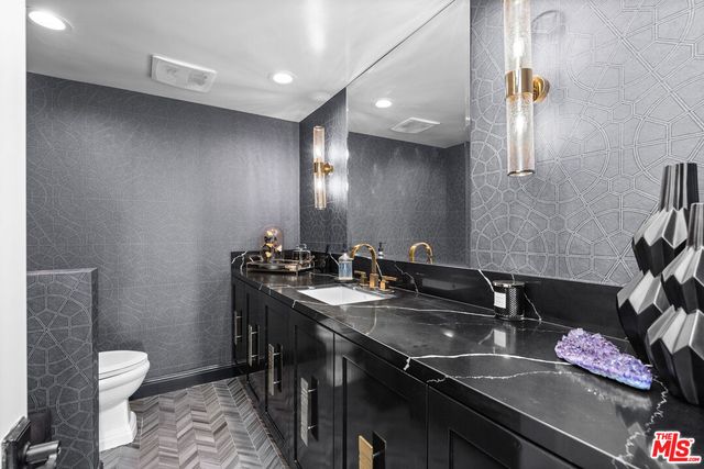 a bathroom with a sink and a toilet