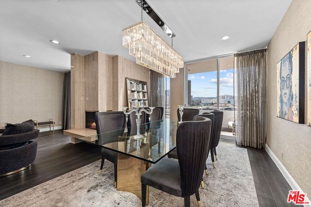a view of a livingroom with furniture window and wooden floor
