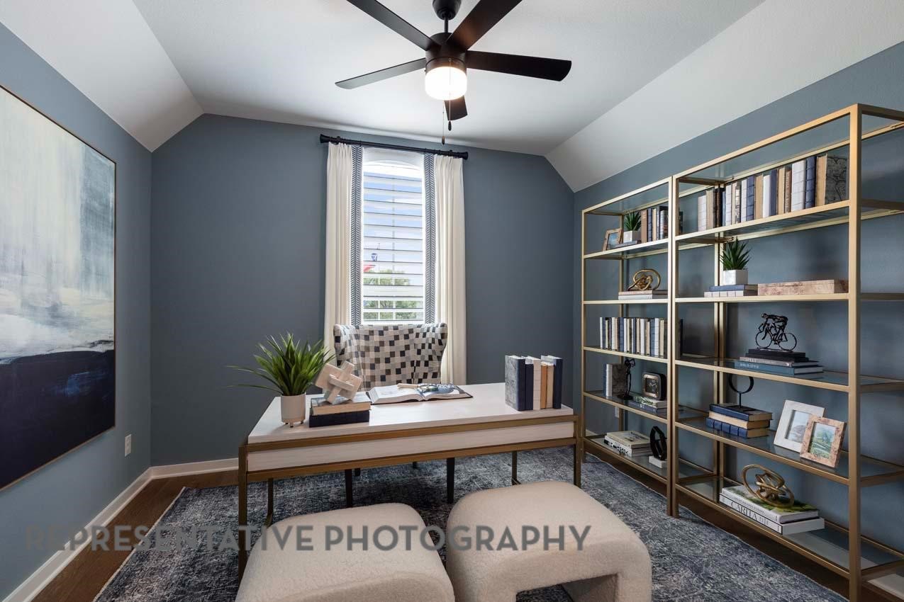 21235 Natalia Grove Magnolia, TX 77355 - Photo 17 of 34 a living room with furniture and a book shelf