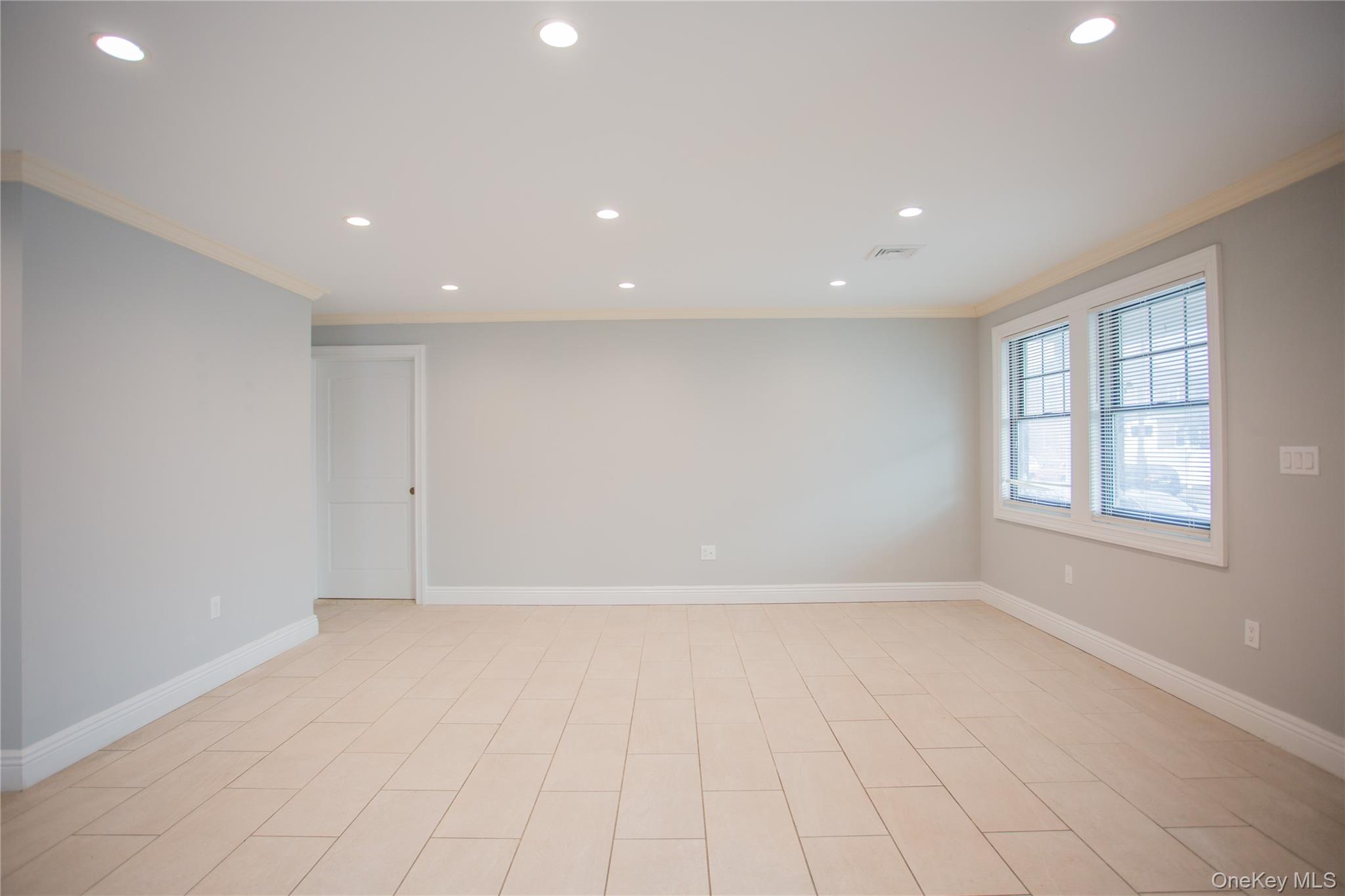 59 Clinton Avenue Inwood, NY 11096 - Photo 7 of 19 an empty room with windows and closet