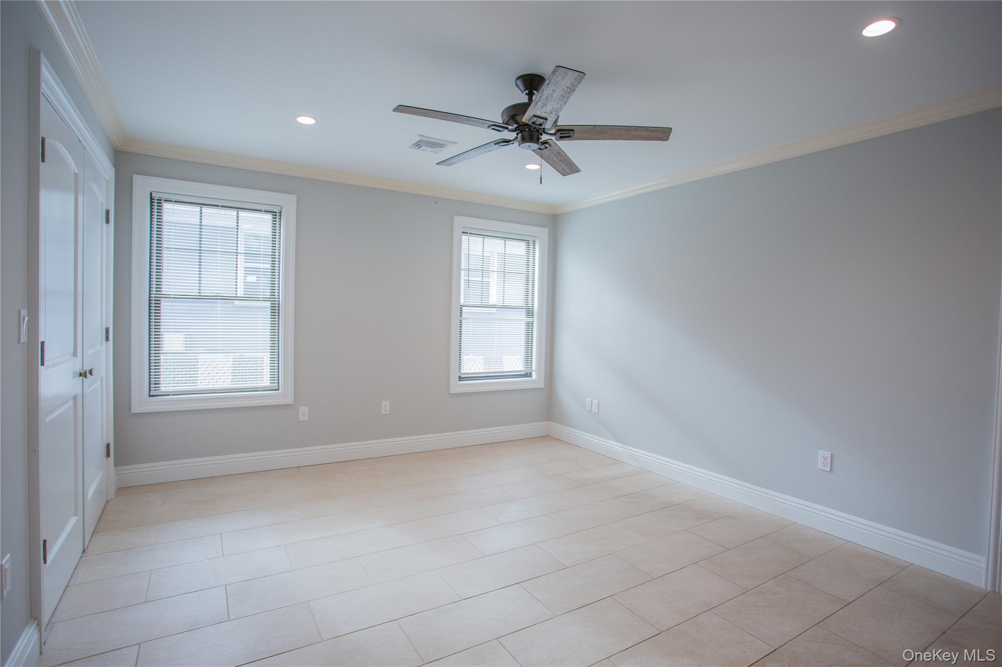 59 Clinton Avenue Inwood, NY 11096 - Photo 9 of 19 a view of an empty room with a window