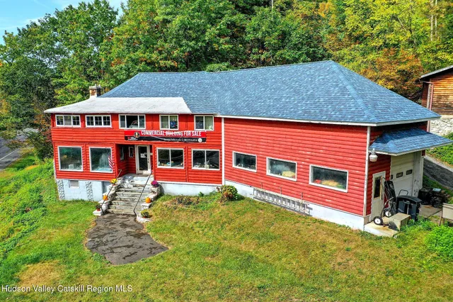 a aerial view of a house with a yard