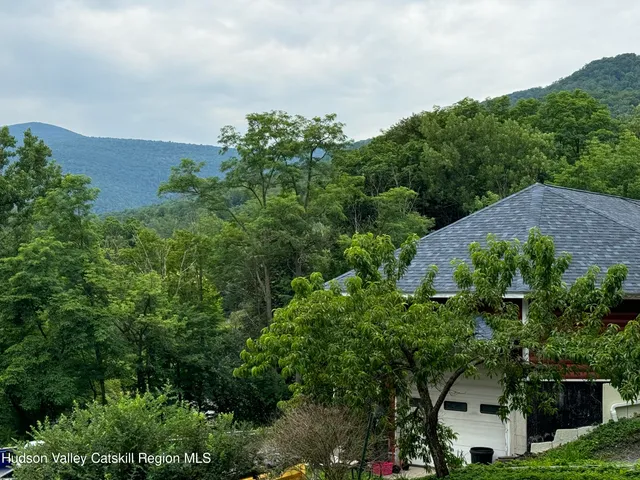 a kitchen with stainless steel appliances a stove microwave and cabinets