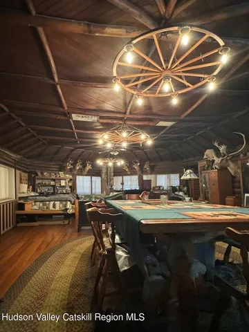 a living room with furniture and a mirror