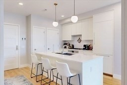 191 Washington Street, Unit 720 Boston, MA 02135 - Photo 2 of 19 a view of dining table and chairs