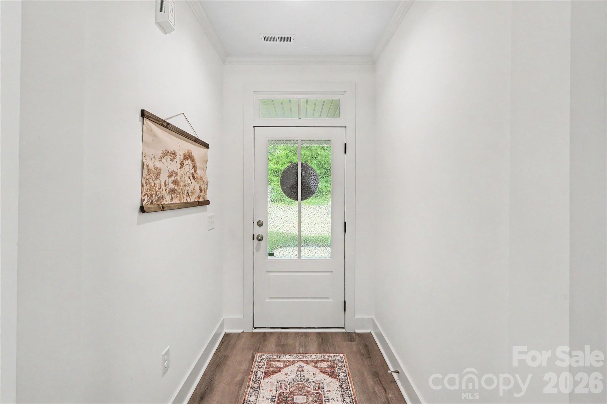 4115 Miller Road Salisbury, NC 28147 - Photo 4 of 26 a view of hallway with window and wooden floor