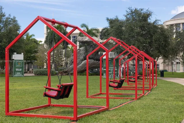 a view of a park with iron fence