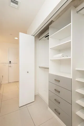 a view of an empty walk in closet