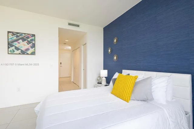 a bedroom with a bed and couch