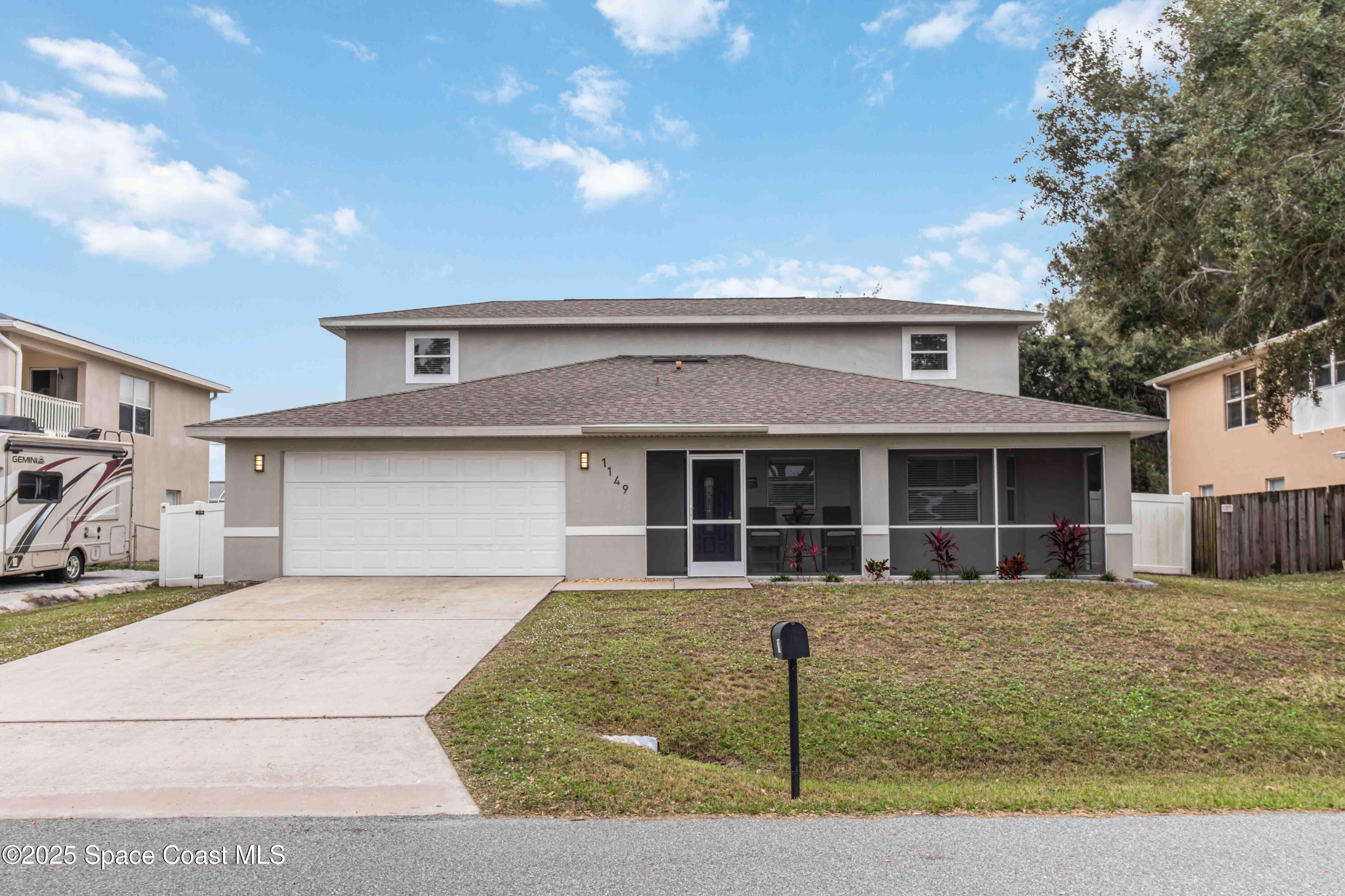 a front view of a house with garage