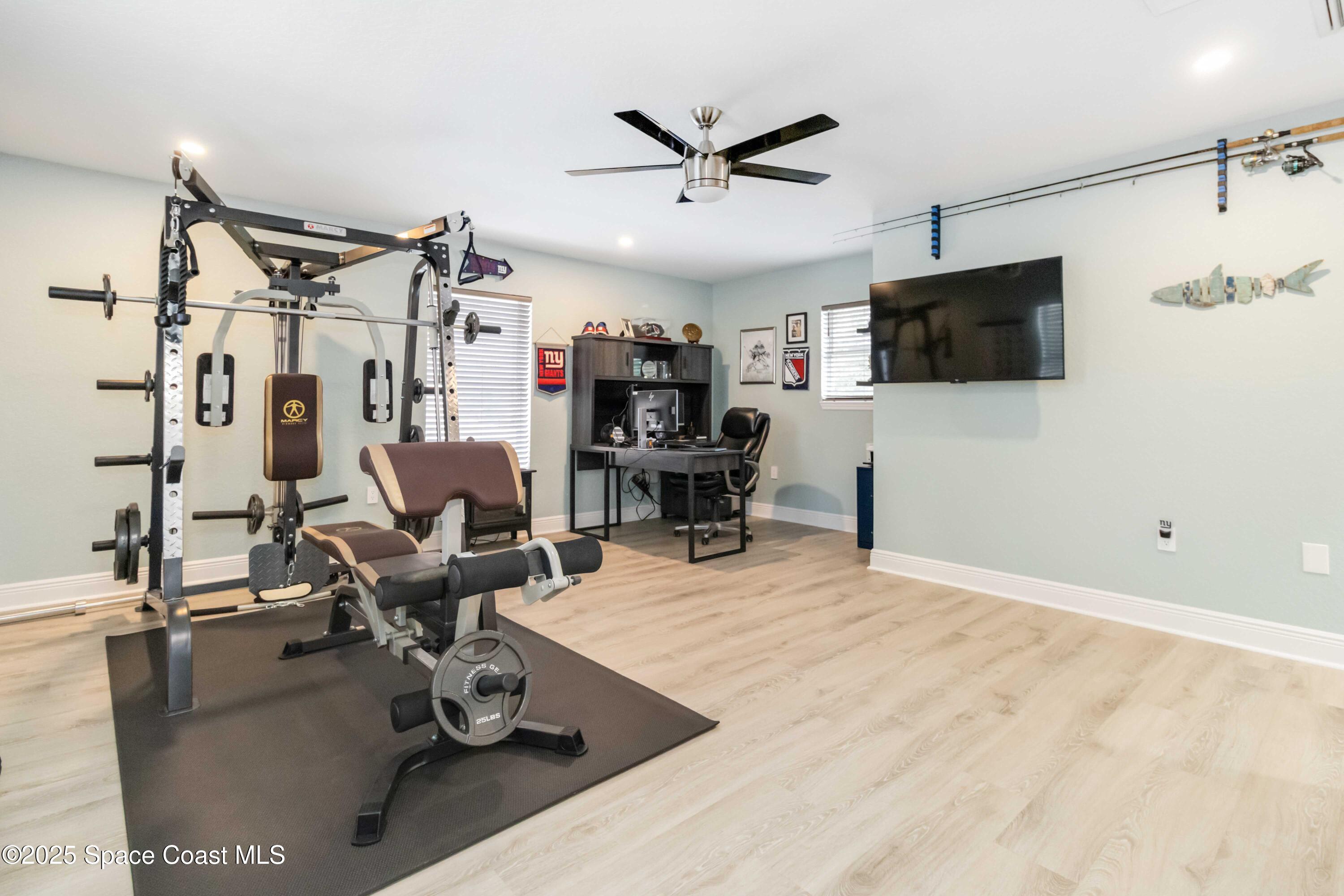 1149 Scyphers Street Northeast Palm Bay, FL 32905 - Photo 27 of 39 a living room with furniture and a flat screen tv