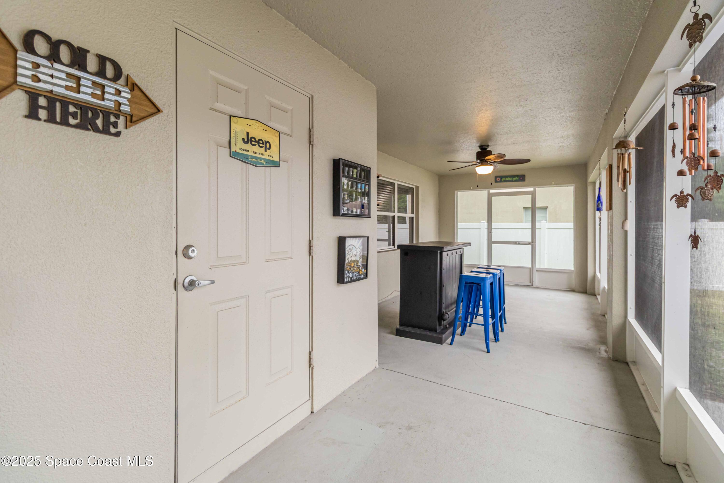 1149 Scyphers Street Northeast Palm Bay, FL 32905 - Photo 35 of 39 a view of kitchen with furniture and refrigerator