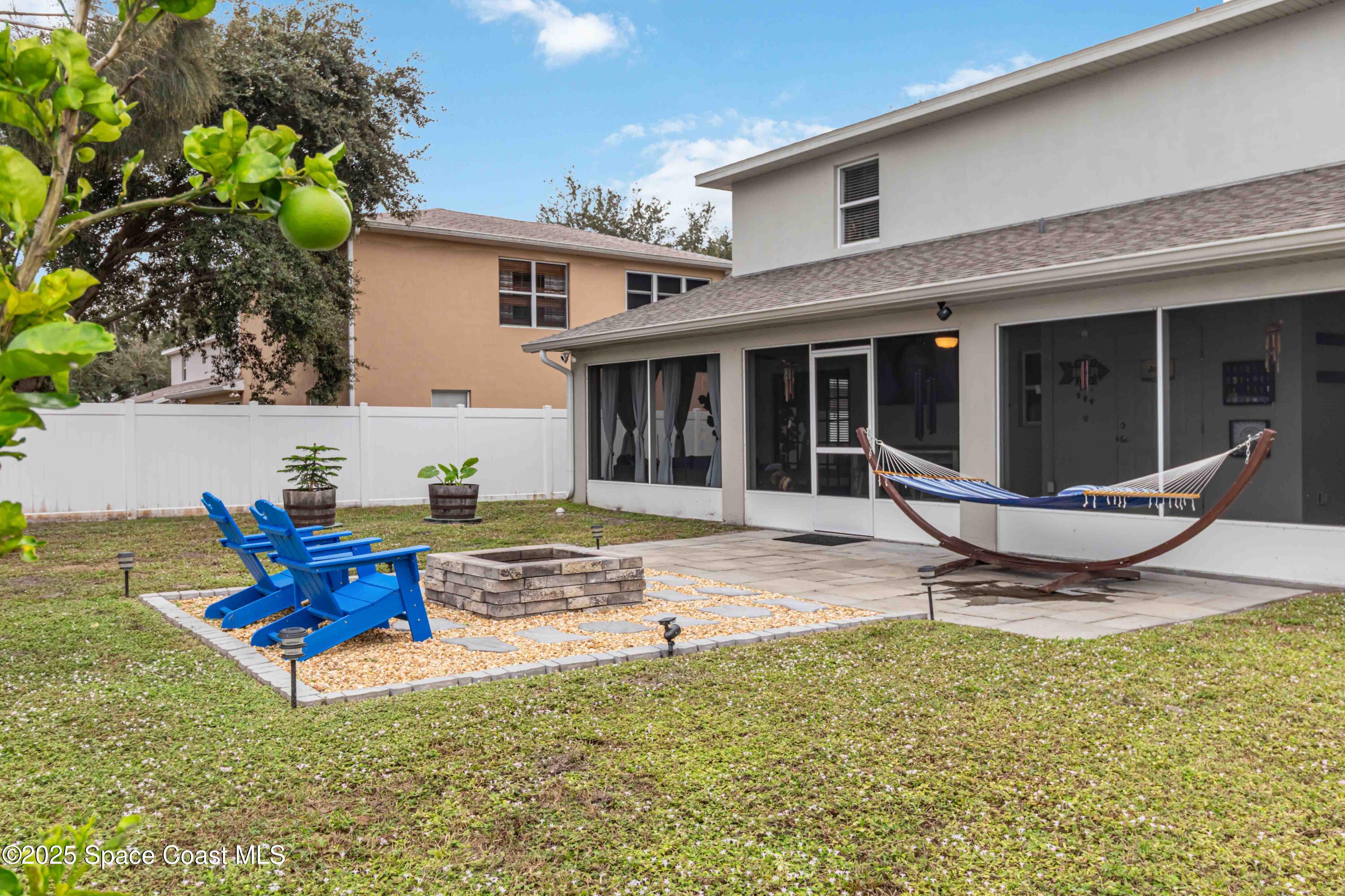 1149 Scyphers Street Northeast Palm Bay, FL 32905 - Photo 39 of 39 a view of a house with backyard and sitting area