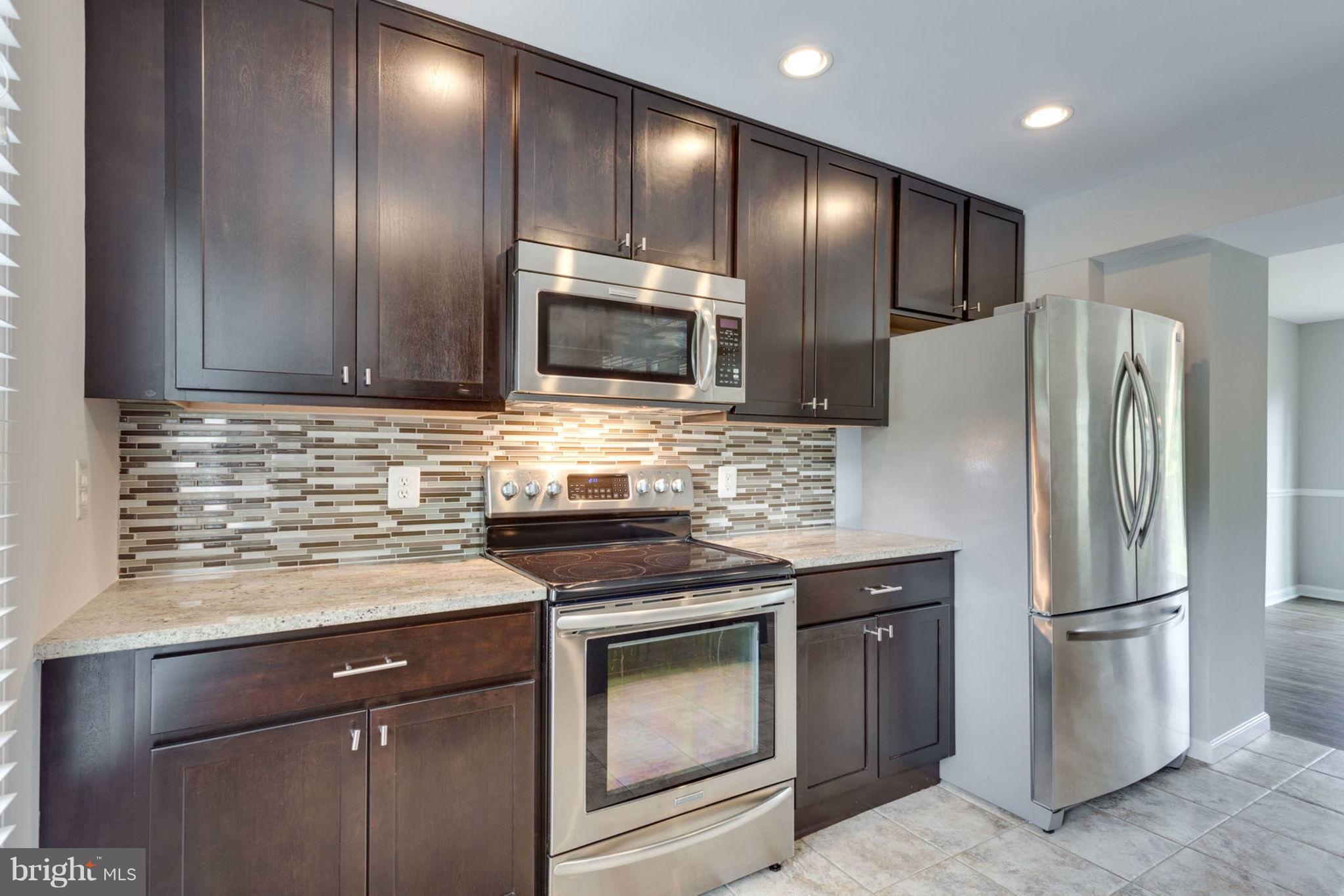 7764 Euclid Way Springfield, VA 22153 - Photo 4 of 18 Gorgeous Kitchen w/ upgraded expresso cabinets