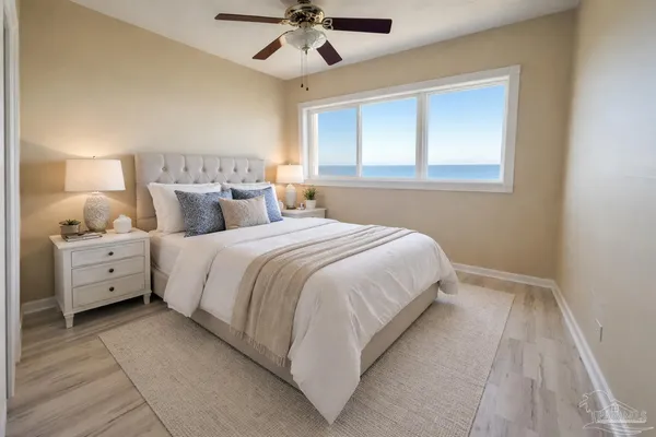 a bed room with a bed and a chandelier