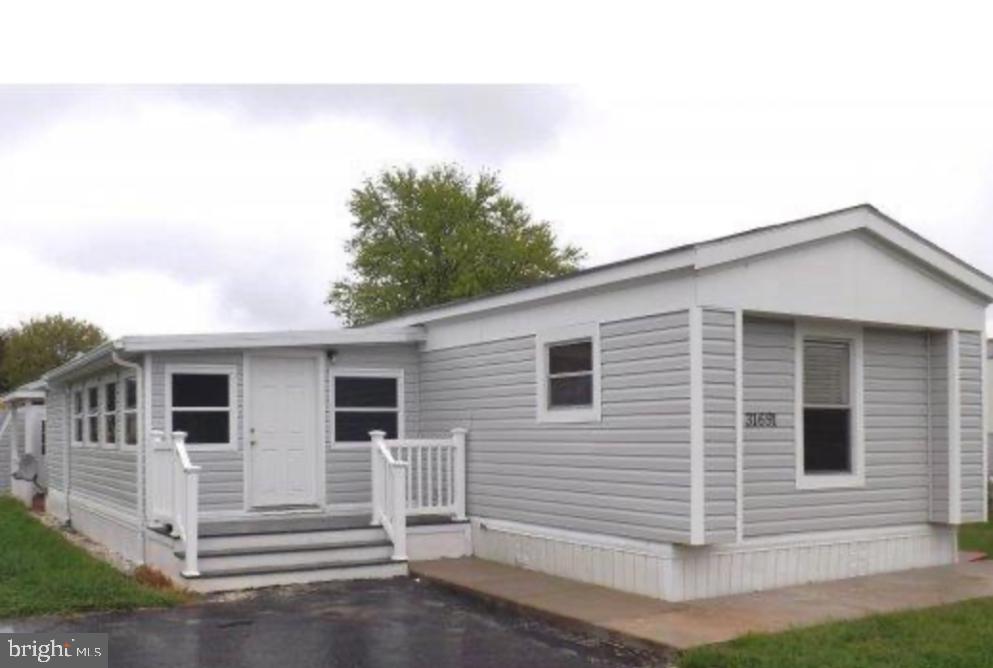 31691 Beach Plum Drive Lewes, DE 19958 - Photo 1 of 1 a view of a house with a garage