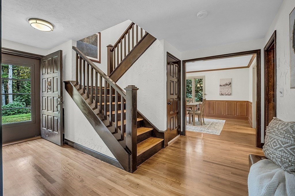 3 Peninsula Road Harvard, MA 01451 - Photo 13 of 42 a view of staircase with wooden floor and a chandelier