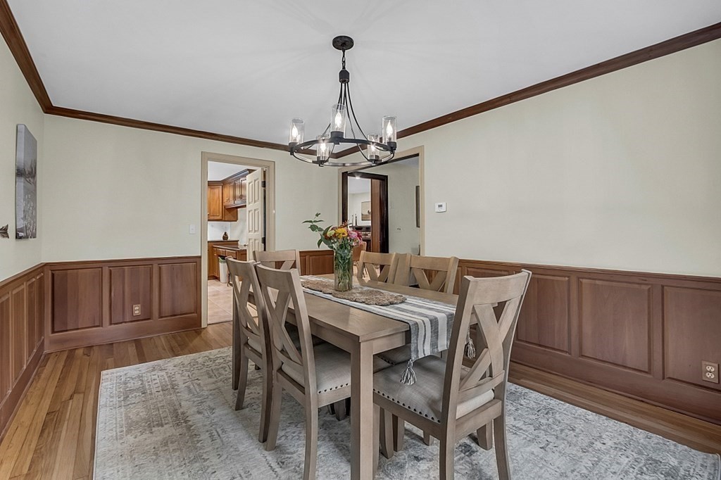 3 Peninsula Road Harvard, MA 01451 - Photo 15 of 42 a view of a dining room with furniture and chandelier