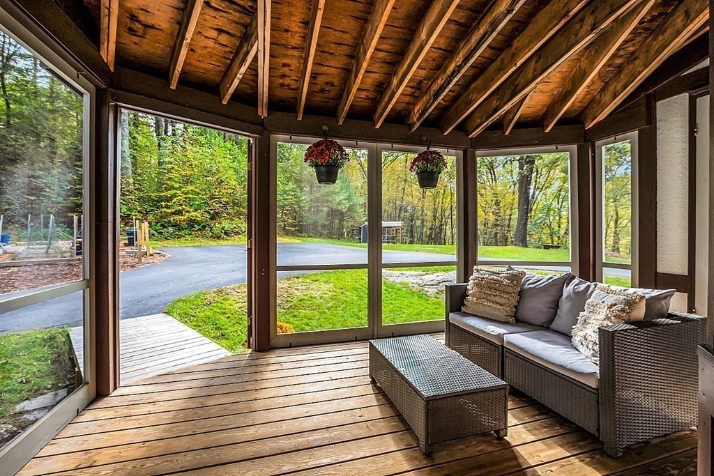 3 Peninsula Road Harvard, MA 01451 - Photo 21 of 42 a roof deck with couch and wooden floor