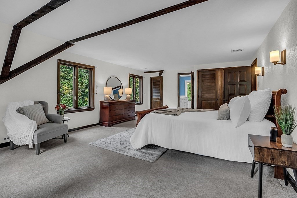 3 Peninsula Road Harvard, MA 01451 - Photo 23 of 42 a spacious bedroom with a bed chair and window