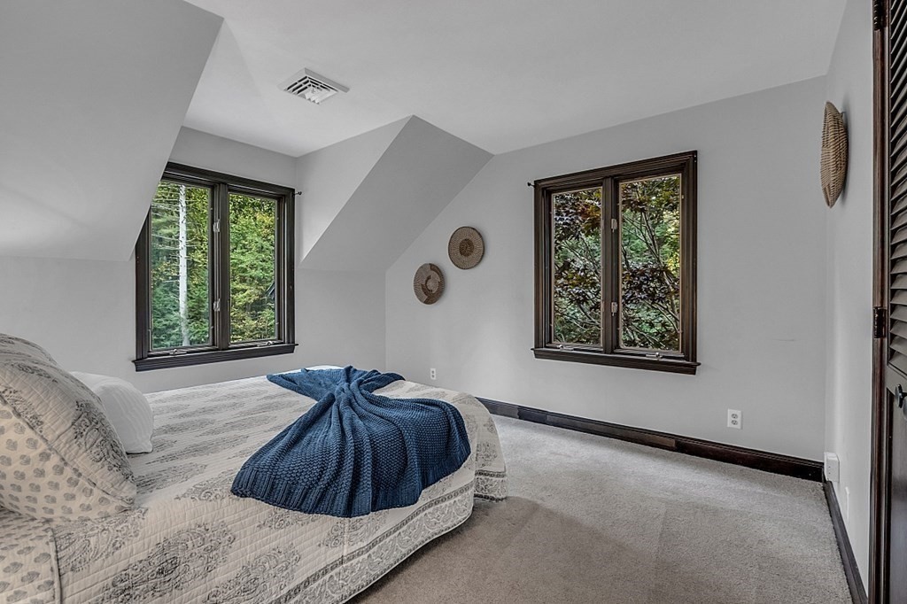 3 Peninsula Road Harvard, MA 01451 - Photo 24 of 42 a bedroom with a bed and a window