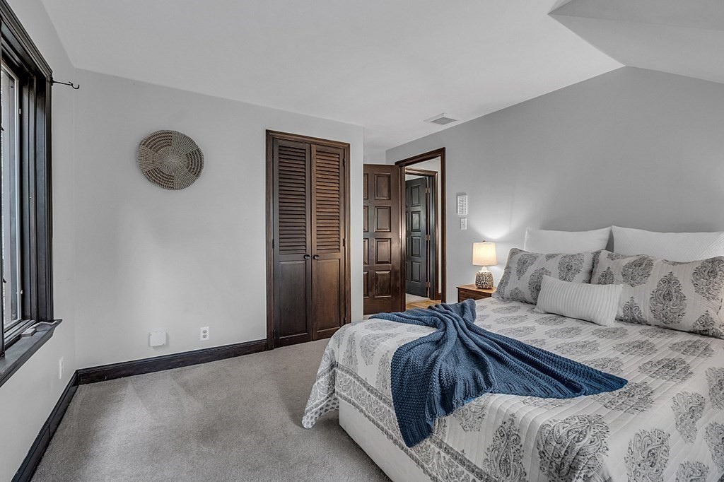 3 Peninsula Road Harvard, MA 01451 - Photo 25 of 42 a bedroom with a bed and a window