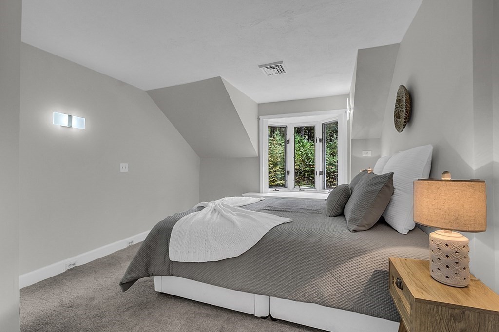 3 Peninsula Road Harvard, MA 01451 - Photo 28 of 42 a bedroom with bed and a window