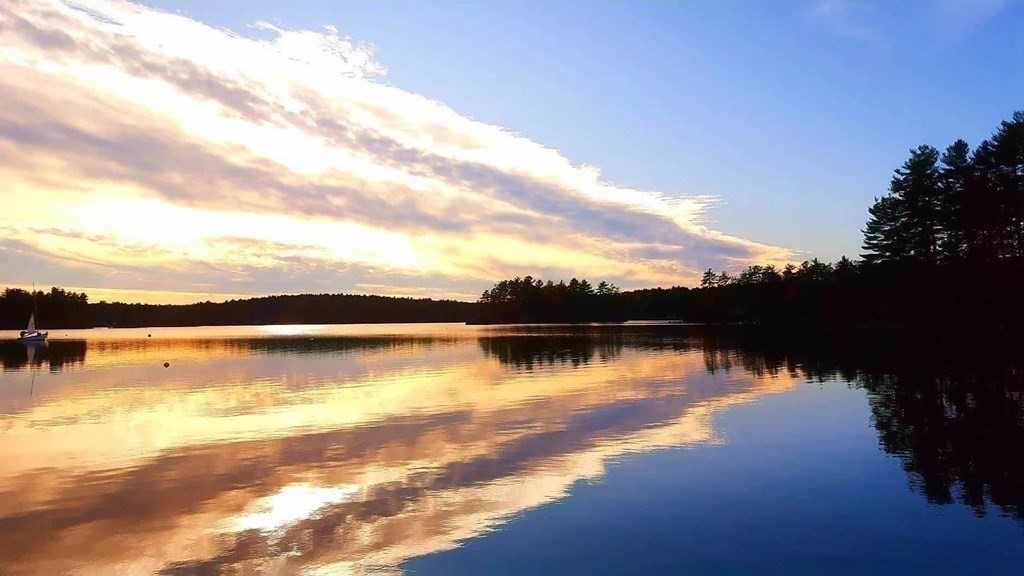 3 Peninsula Road Harvard, MA 01451 - Photo 39 of 42 a view of a lake in middle of a house with a lake