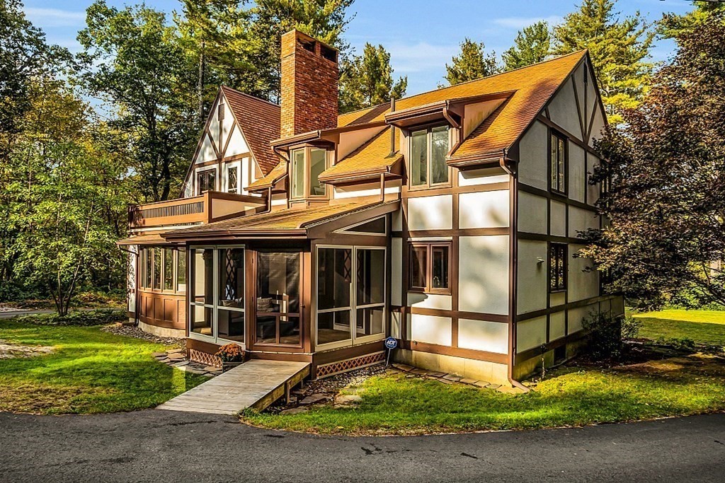 3 Peninsula Road Harvard, MA 01451 - Photo 5 of 42 a view of a house with a wooden floor and a yard with plants