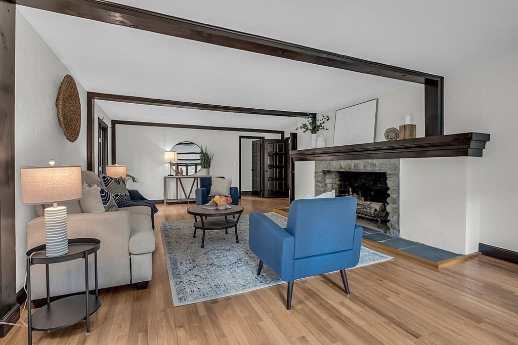 3 Peninsula Road Harvard, MA 01451 - Photo 9 of 42 a living room with furniture and a fireplace