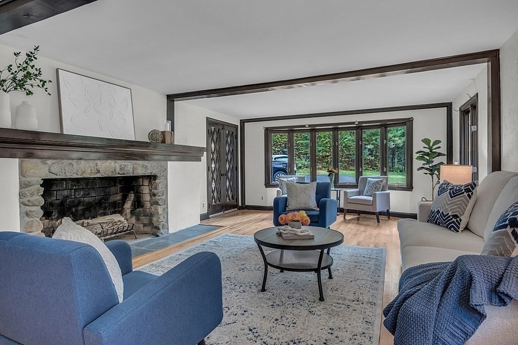 3 Peninsula Road Harvard, MA 01451 - Photo 10 of 42 a living room with furniture and a fireplace