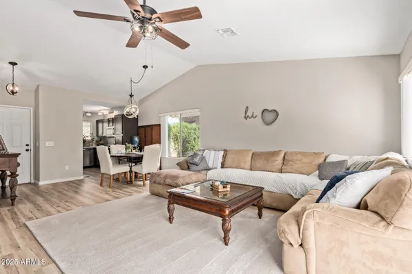 a living room with furniture and a window