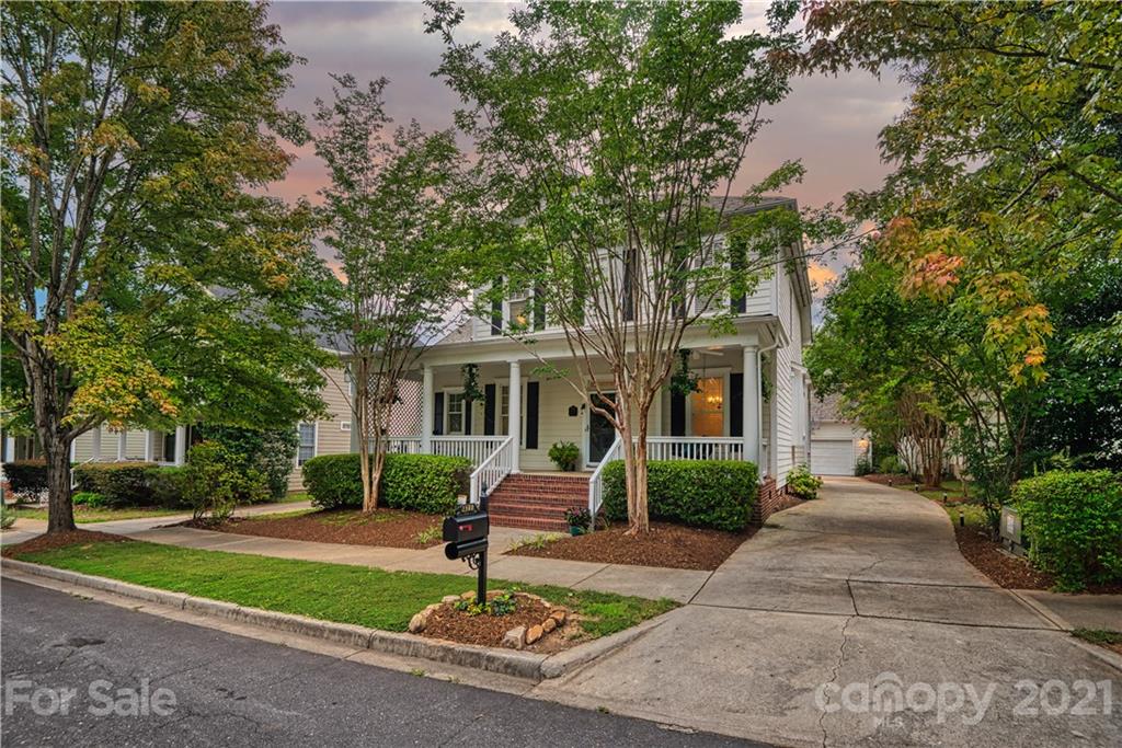 1380 Barnett Woods Fort Mill, SC 29708 - Photo 2 of 31 a front view of a house with a yard and trees