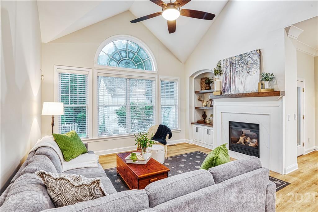 1380 Barnett Woods Fort Mill, SC 29708 - Photo 14 of 31 a living room with furniture a fireplace and a large window