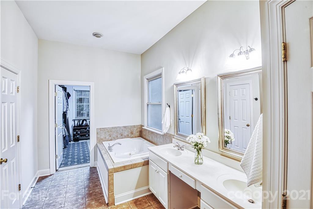 1380 Barnett Woods Fort Mill, SC 29708 - Photo 20 of 31 a bathroom with a sink a toilet and mirror