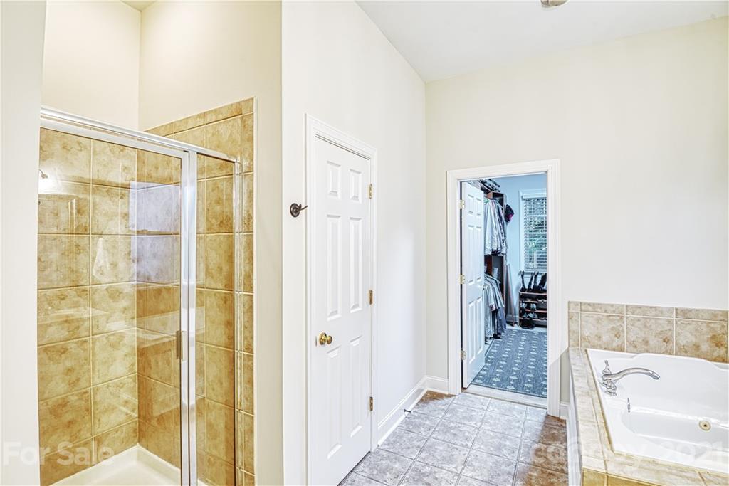 1380 Barnett Woods Fort Mill, SC 29708 - Photo 21 of 31 a bathroom with a tub and shower