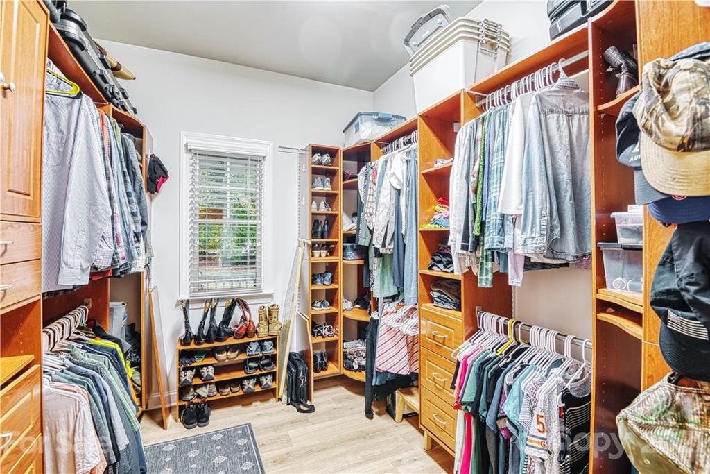 1380 Barnett Woods Fort Mill, SC 29708 - Photo 22 of 31 a view of walk in closet with clothes and shoes